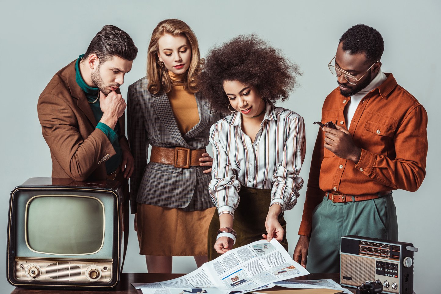 multicultural retro styled journalists in newsroom isolated on grey